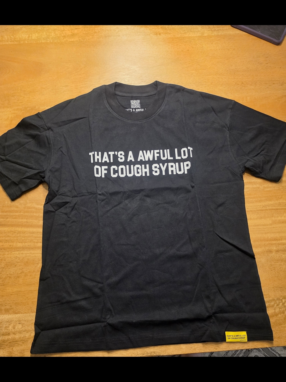 Black Graphic Tee with Bold White Slogan